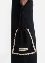 Load image into Gallery viewer, Silk pouch with crochet trim in black
