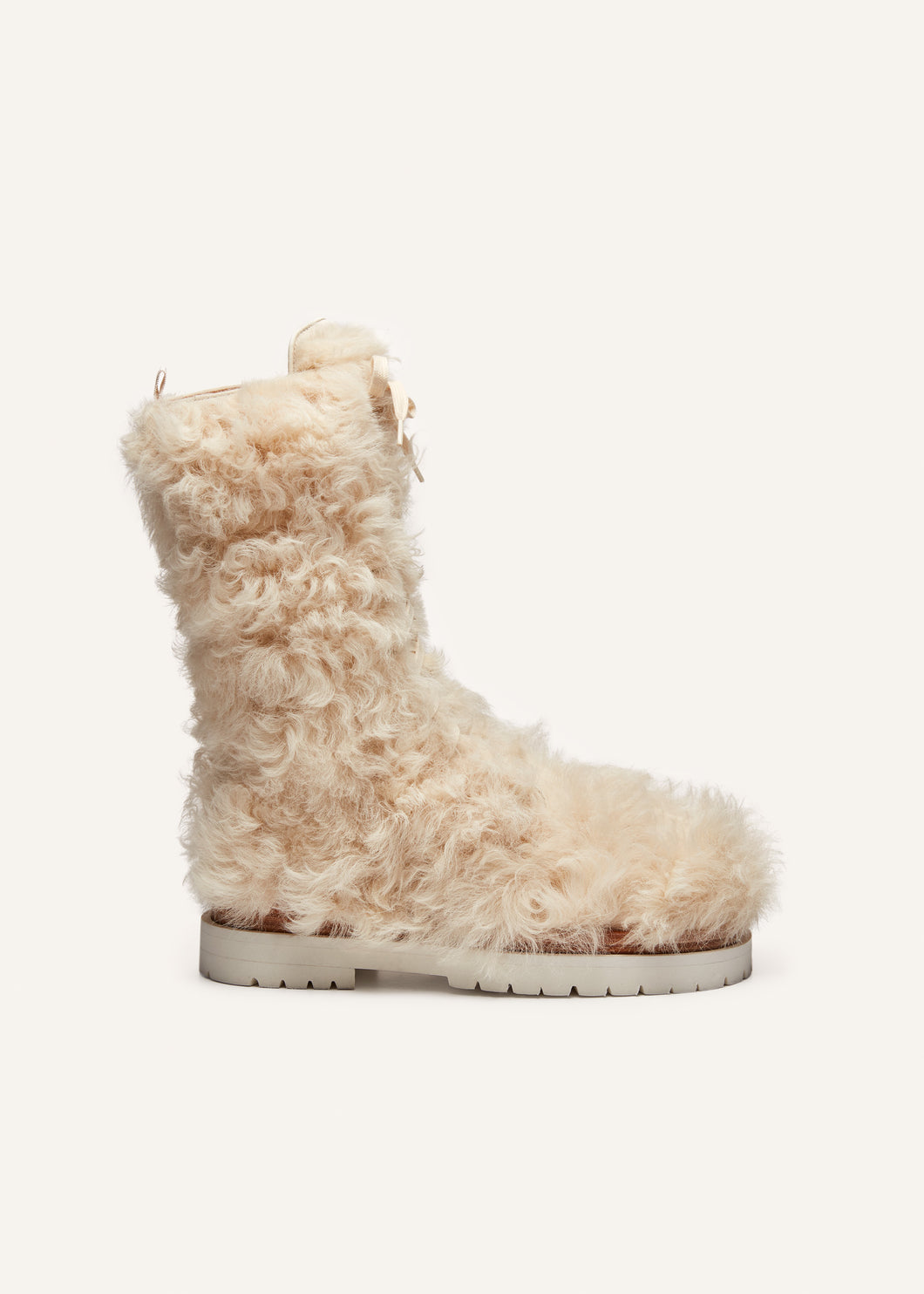 Shearling combat boots in cream