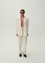 Load image into Gallery viewer, Tapered wool trousers in cream
