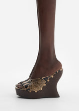 Load image into Gallery viewer, Snake-embossed wedge mules in brown
