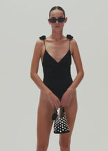 Load and play video in Gallery viewer, V neck swimsuit with rosettes in black

