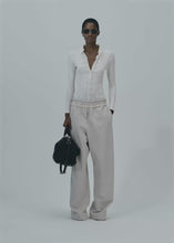 Load and play video in Gallery viewer, Long-sleeve tricot polo bodysuit in cream
