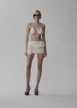 Load and play video in Gallery viewer, Crepe rose mini skirt in cream
